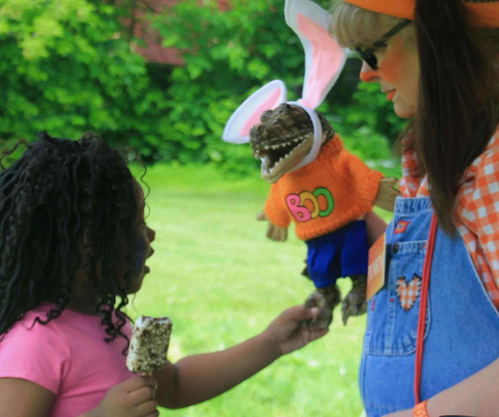young girl playing with puppet