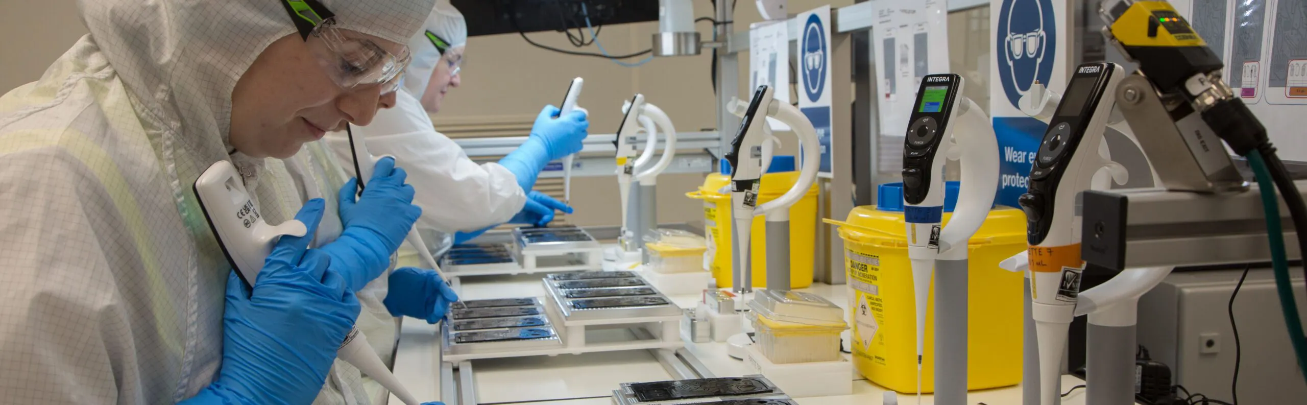 staff at work wearing eye protection goggles