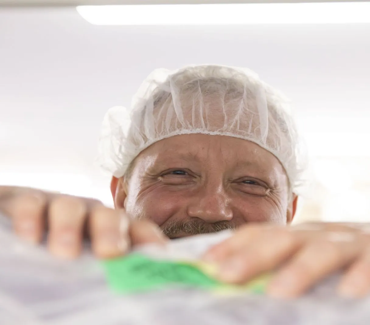 smiling man wearing cap
