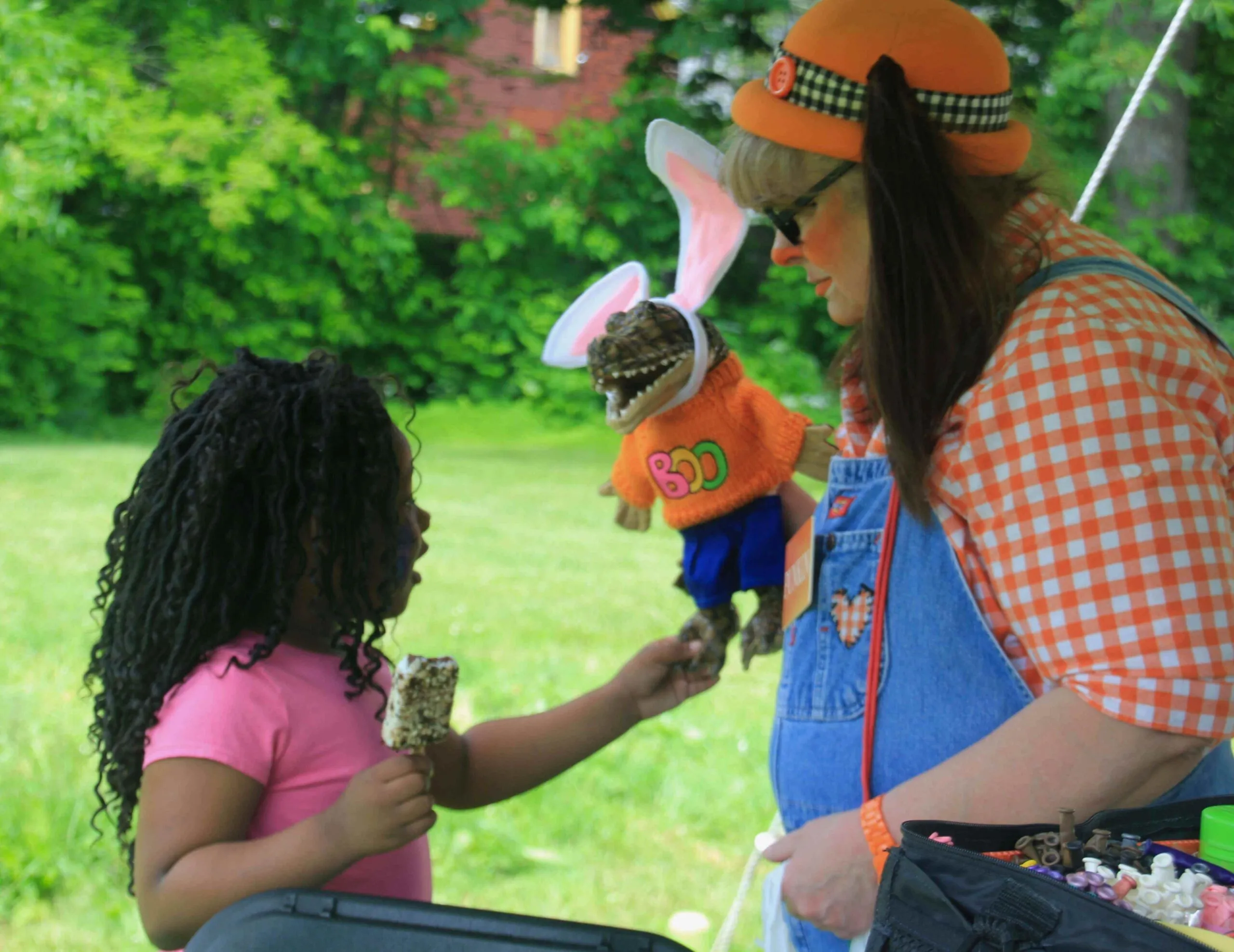 girl interacting with clown on bailey green community day