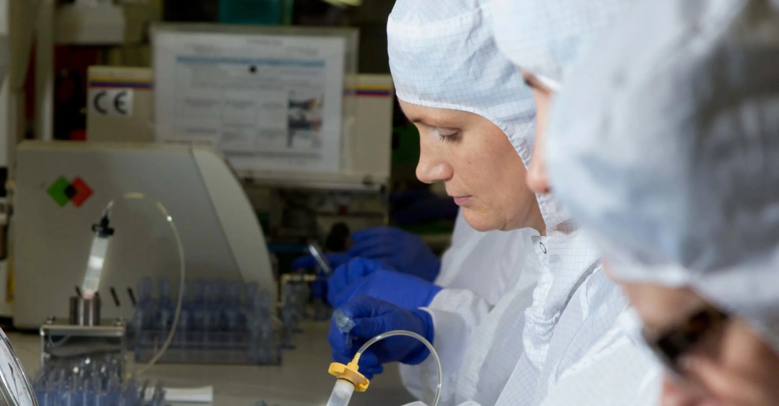 focused concentration from medical cleanroom technician