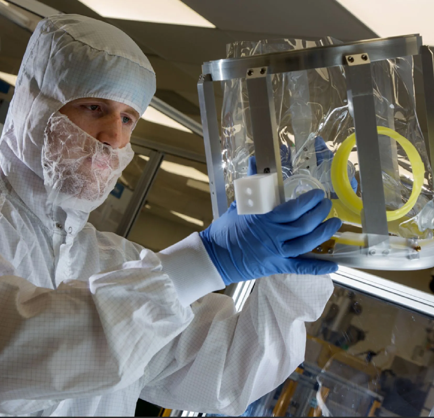 lean line attendant in cleanroom gear