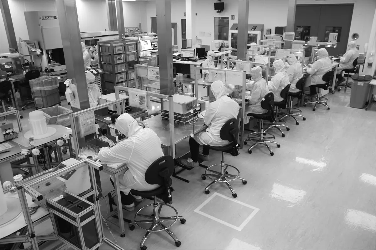 medical device personnel in lab